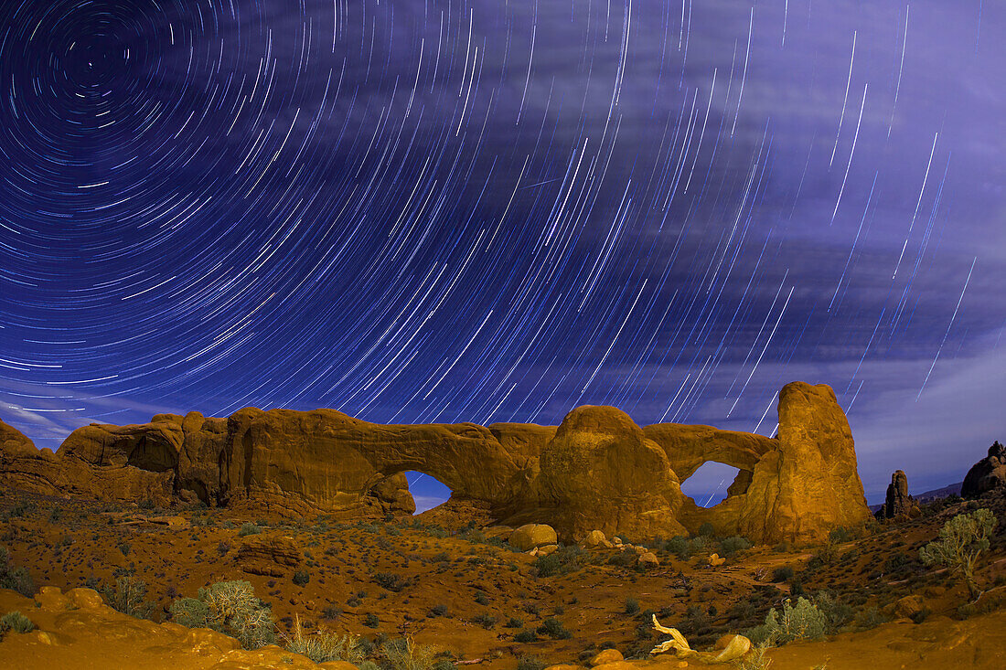 Star trails over the North and South Windows, Utah, USA