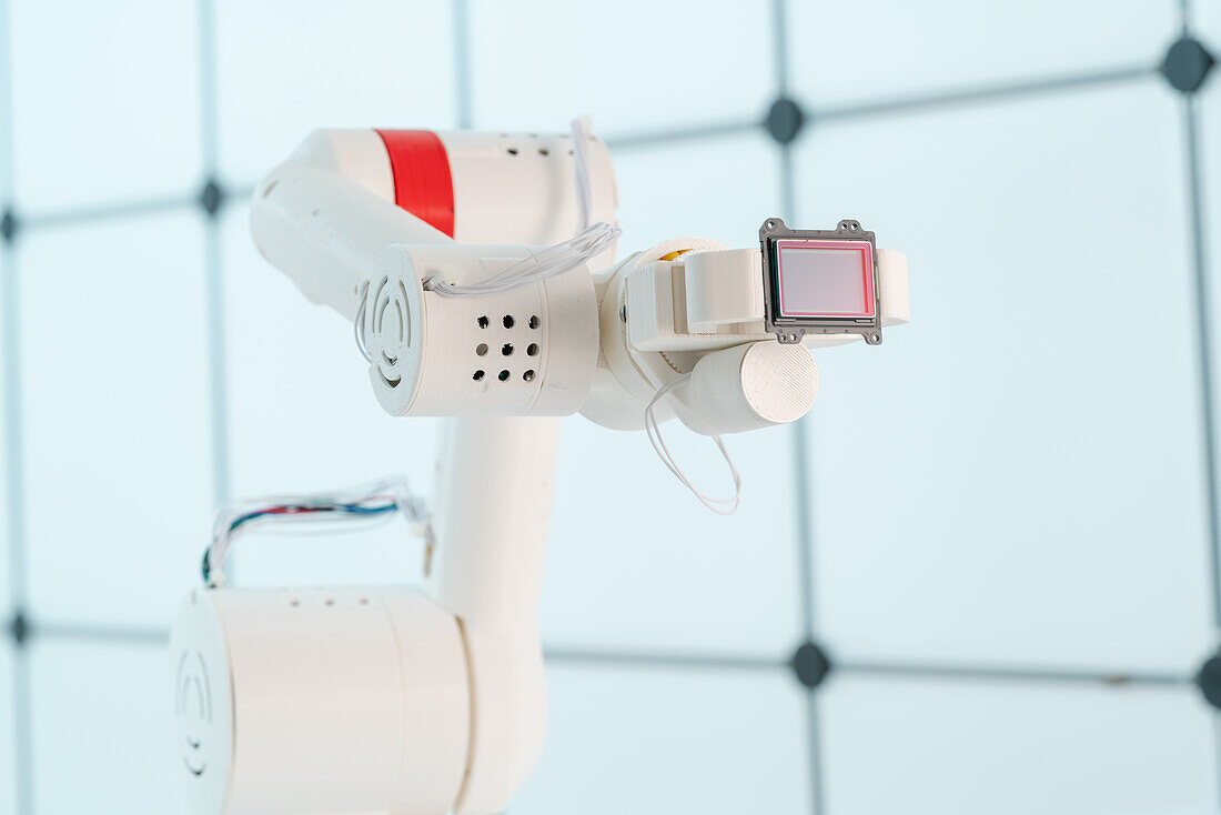 Robotic arm holding sensor