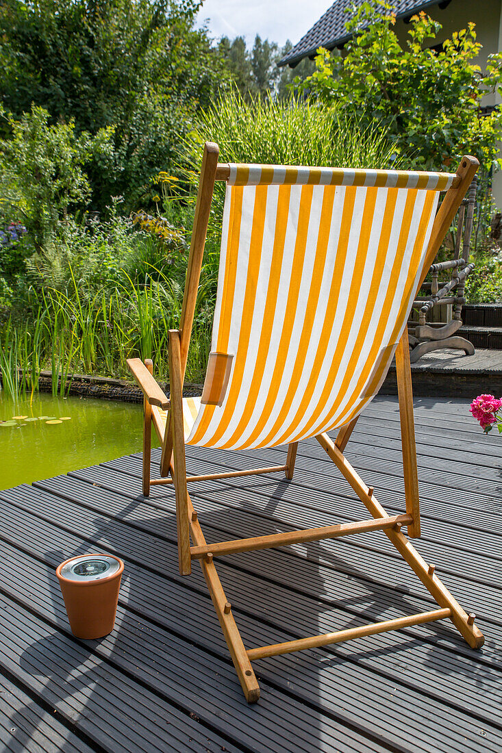 Relaxing chair by the garden pond