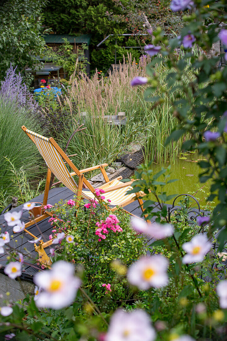 Relaxing chair by the garden pond