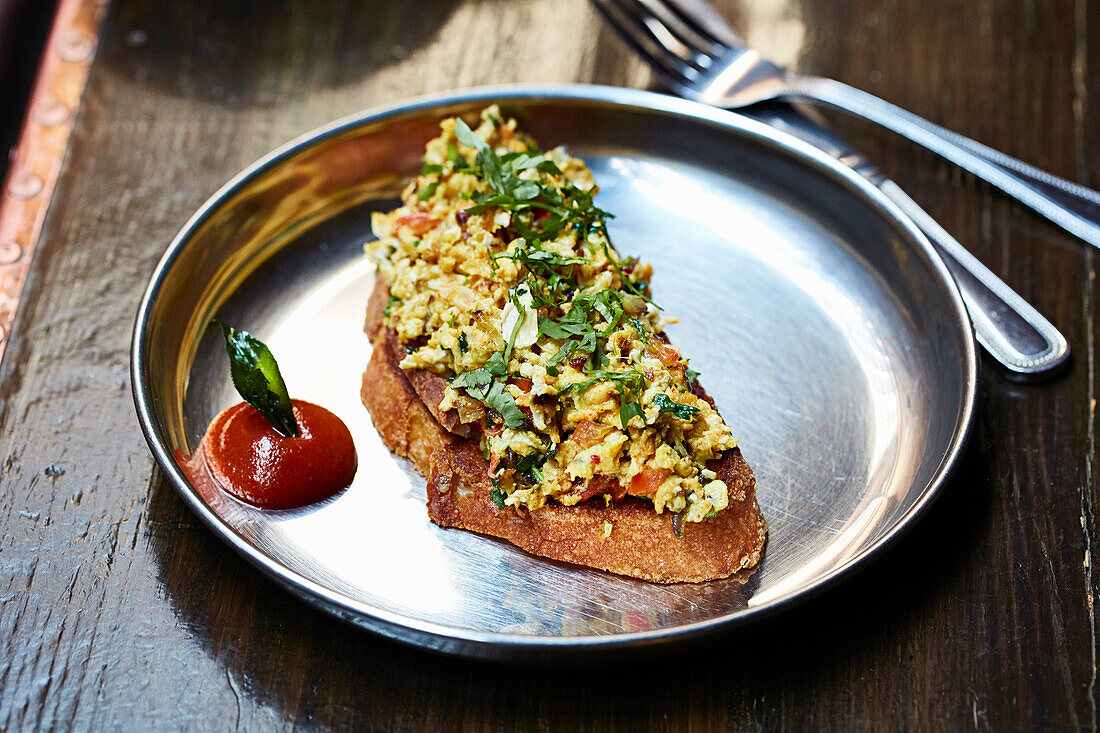 Indian spiced scrambled eggs on toast