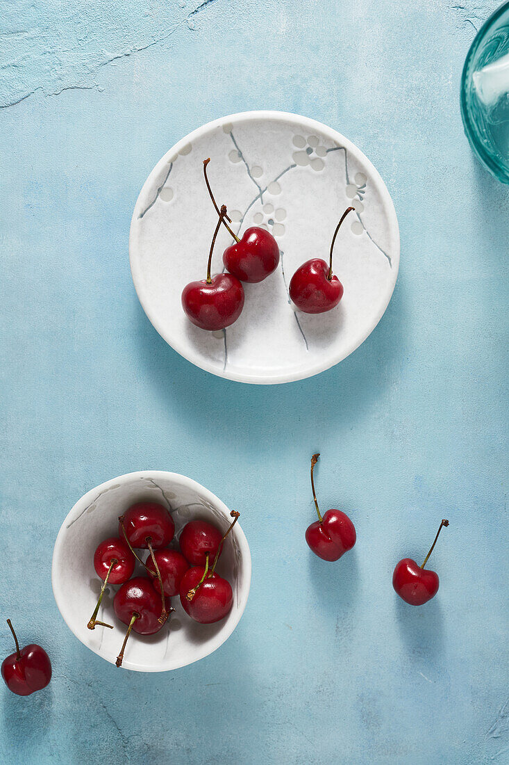 Fresh red cherries on a blue background