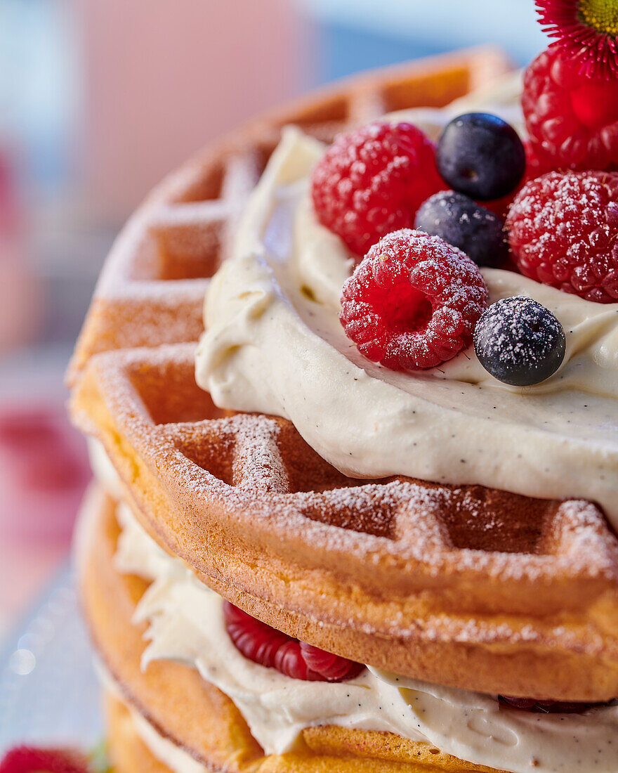 Waffle cake with cream filling and summer berries