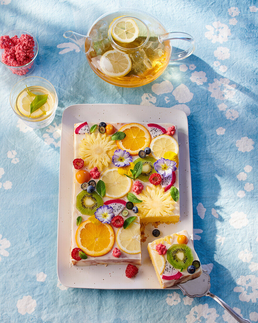 Juicy lemon cake with fruit slices