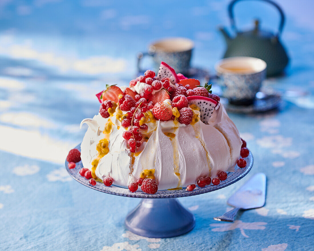 Pavlova with berries and exotic fruits