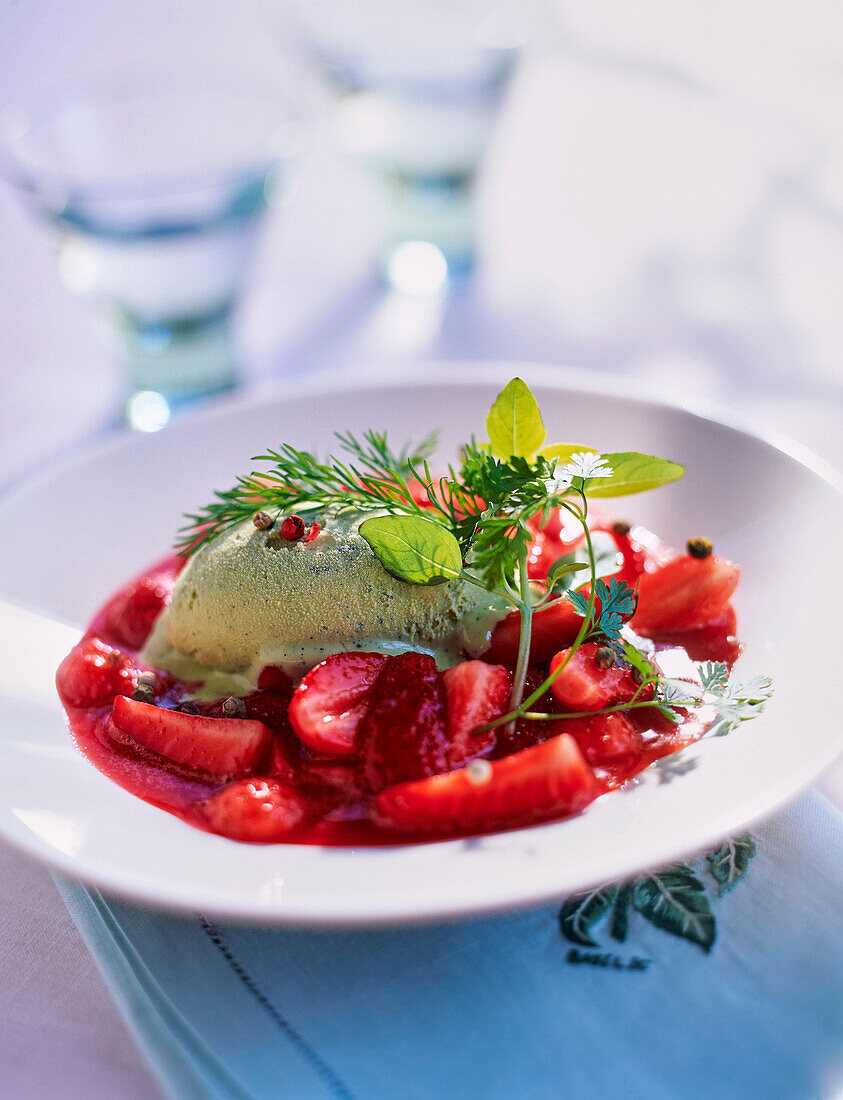 Herb ice cream on macerated strawberries