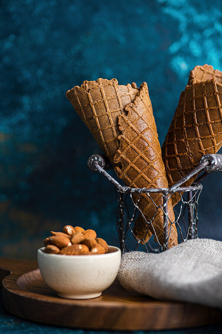 Empty ice cream cones on green concrete background