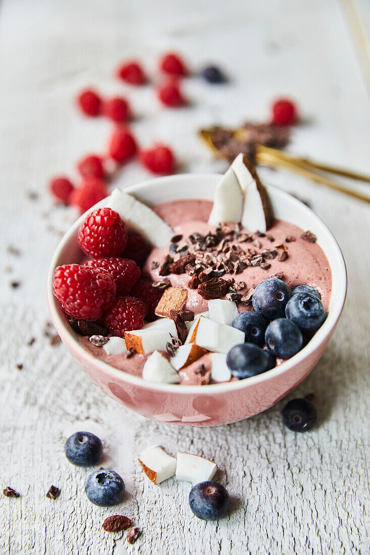 Smoothie Bowl with berries, cocoa nibs and coconut