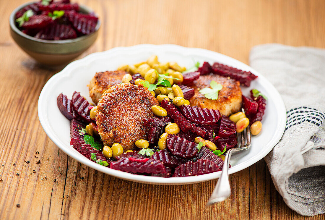 Marinated beetroot with fish cakes and edamame