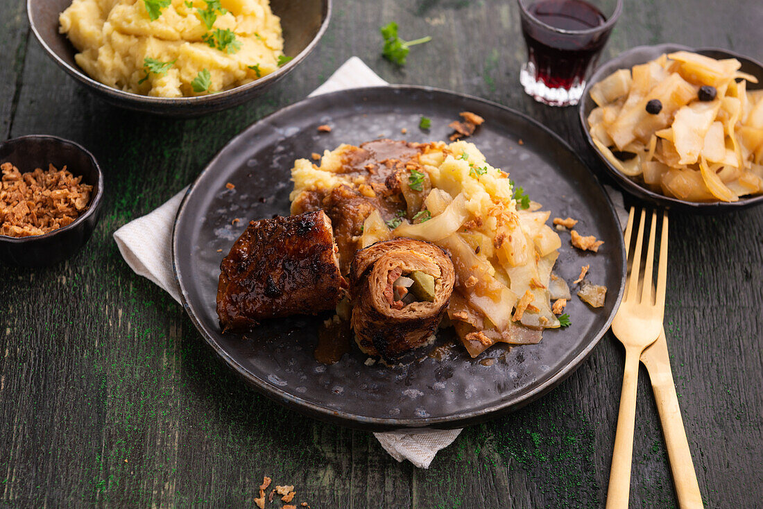 Vegan roulade made from soy protein with Bavarian cabbage and mashed potatoes