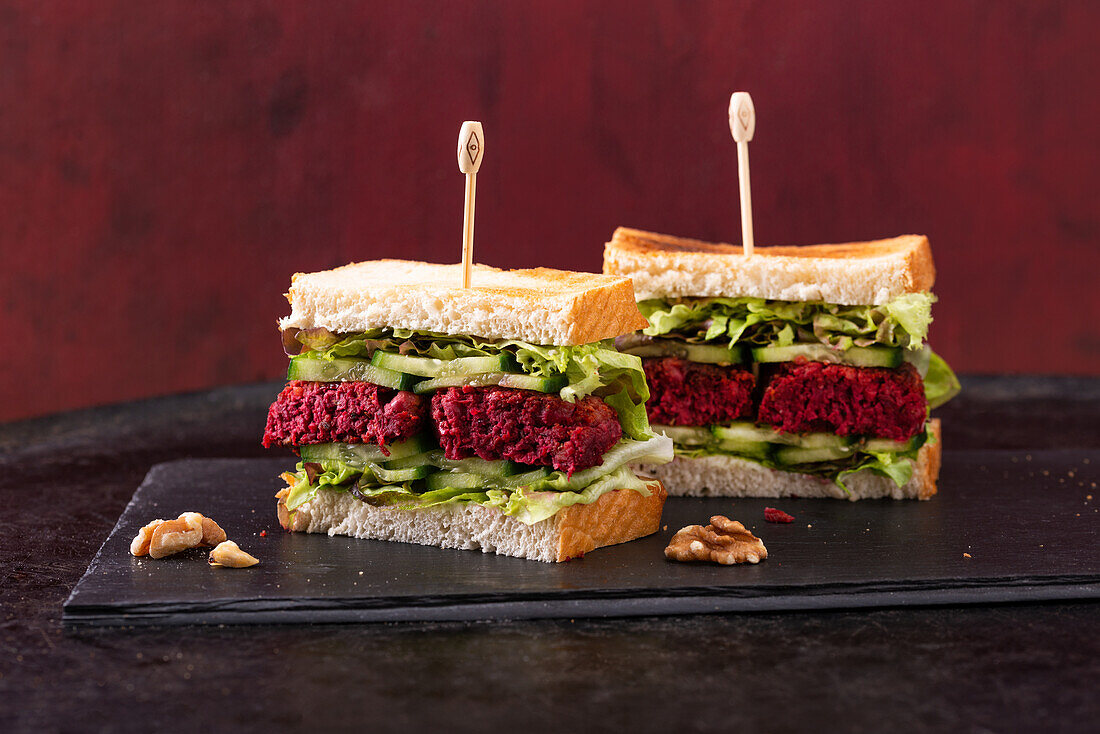 Vegan sandwiches with cucumber, lettuce and beetroot fritters