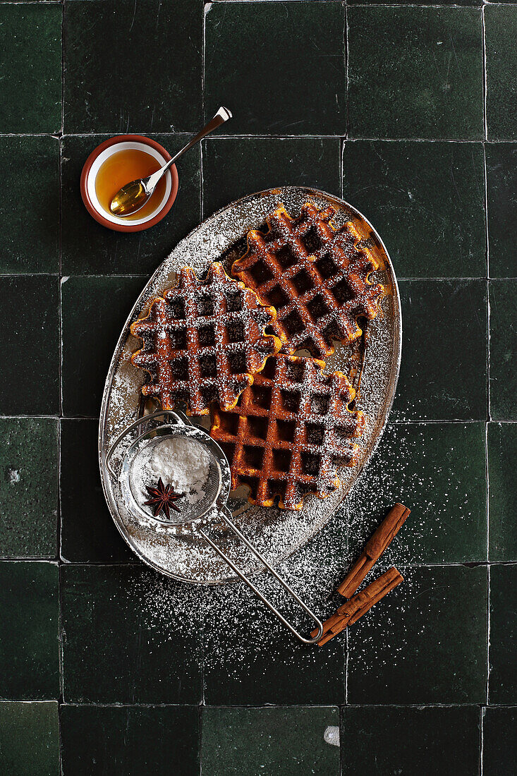 Homemade spicy pumpkin waffles with icing sugar