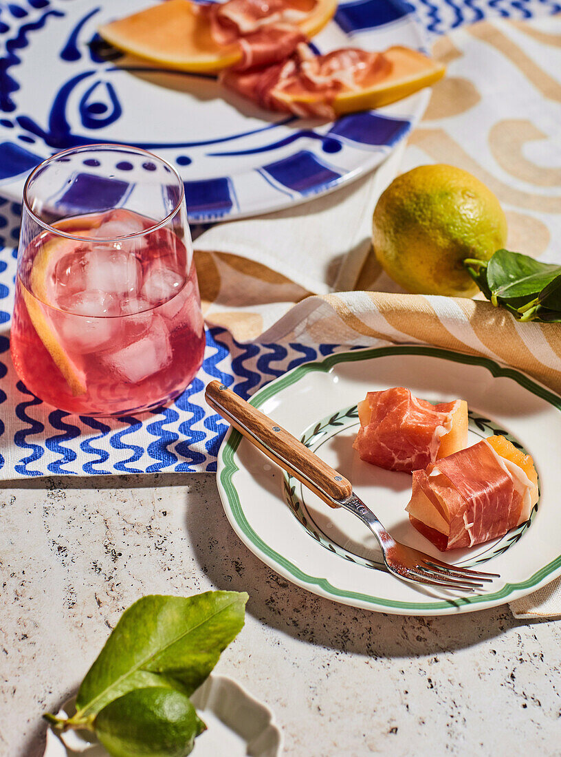 Melon in Parma ham served with Campari soda