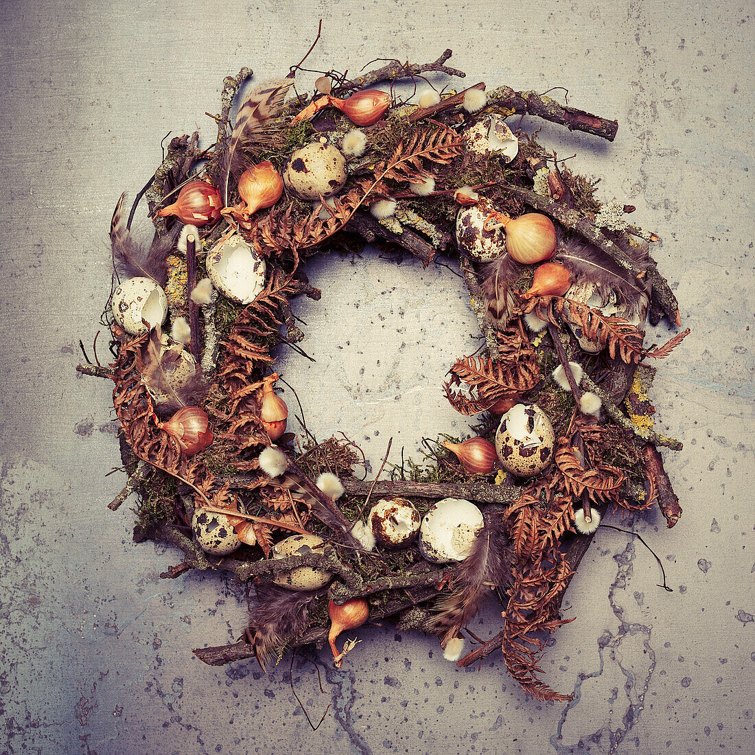 Easter wreath made of twigs, onions and quail eggs