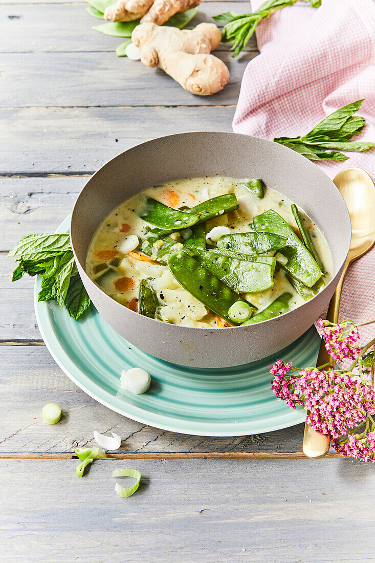 Potato and coconut curry with sugar snap peas