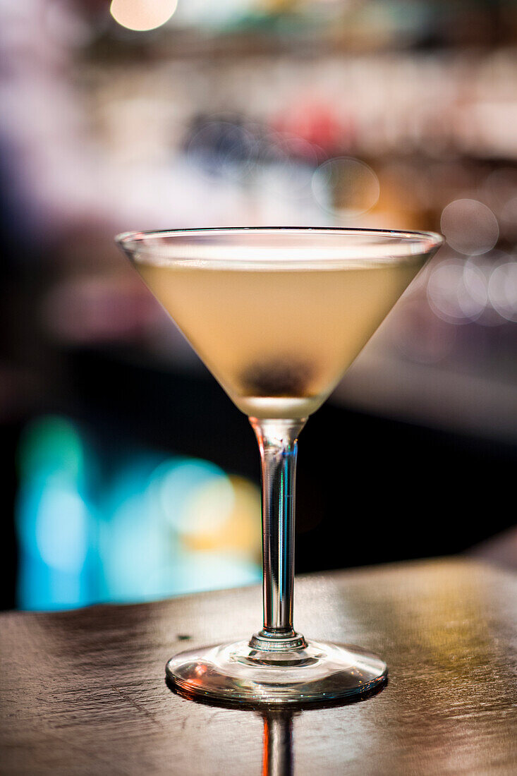 Martini in a glass on a bar counter