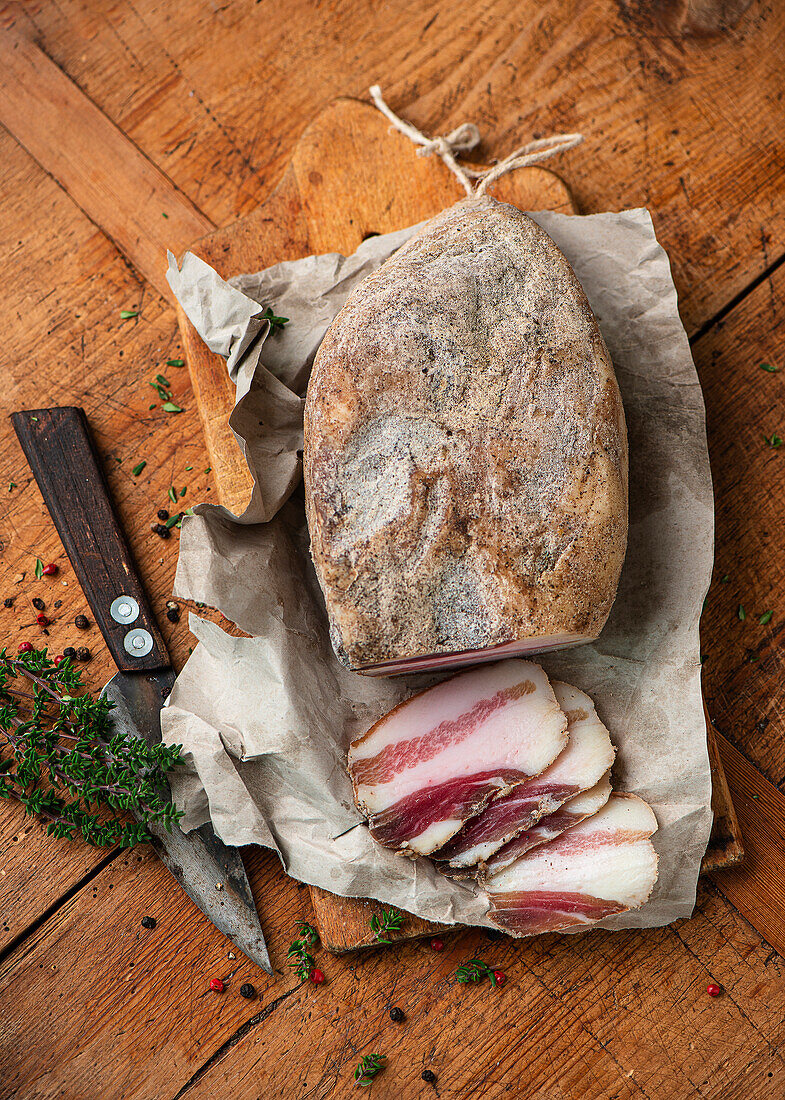 Slices of Guanciale on butchers paper