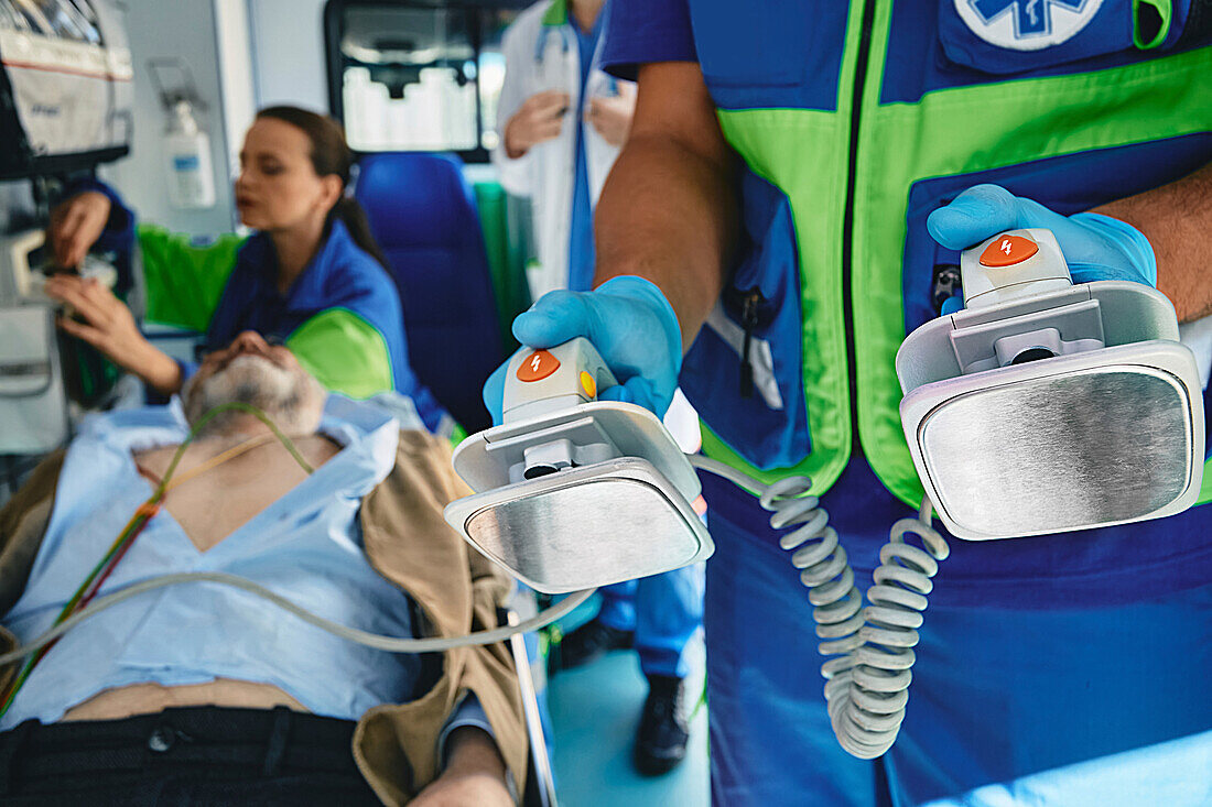 Paramedics treating patient in ambulance