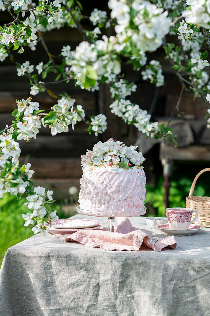 Cream cake with spring flowers