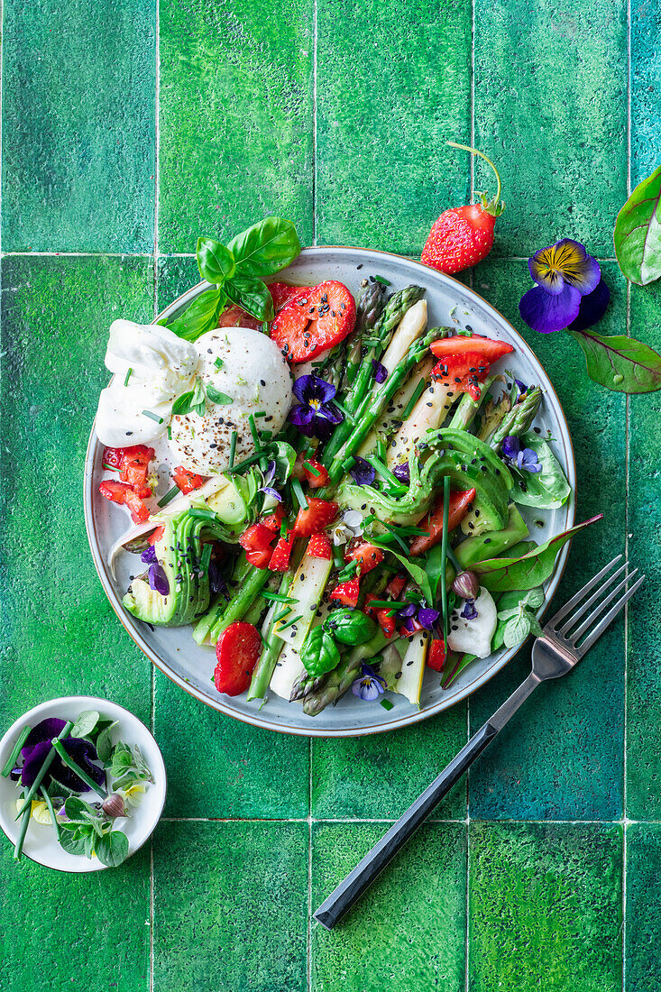 Asparagus salad with burrata, strawberries and avocado