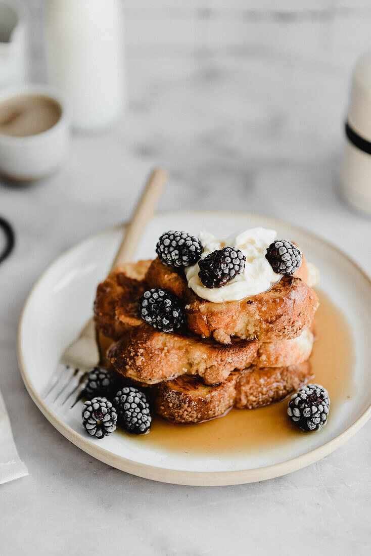 Challah toast with yogurt, blackberries and maple syrup