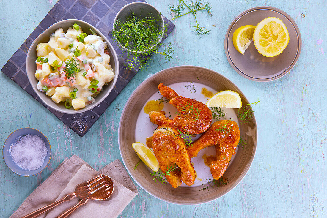 Breaded carp with potato salad