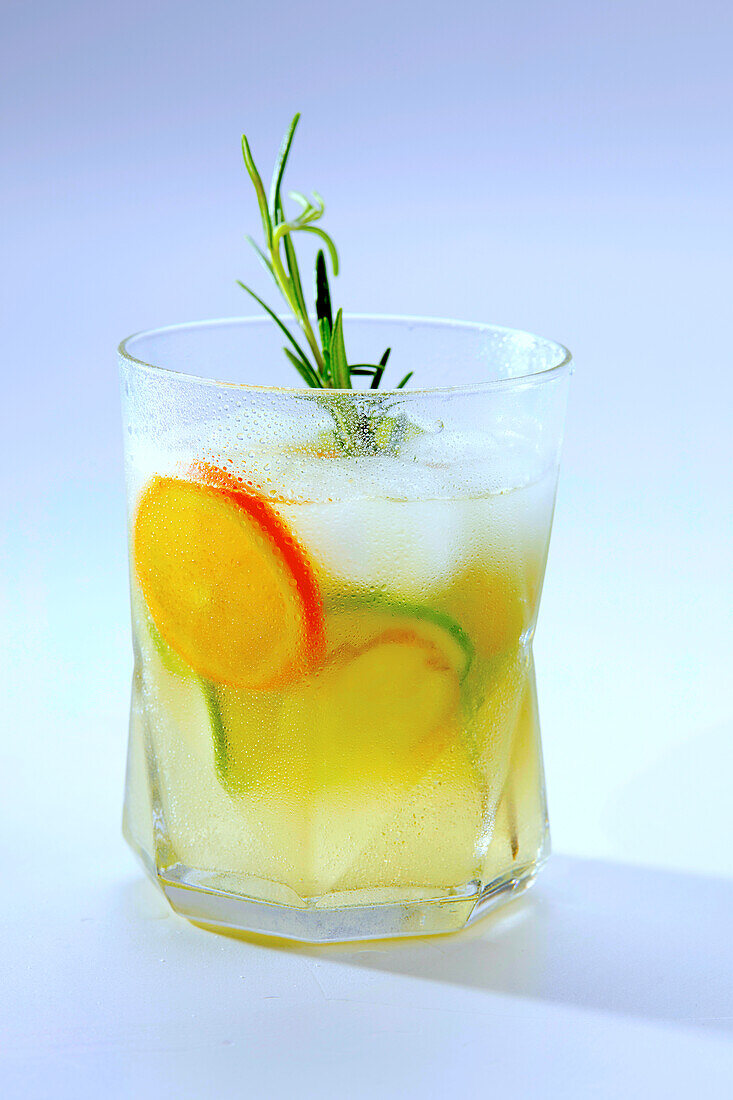 Cocktail with ginger beer, orange and cucumber