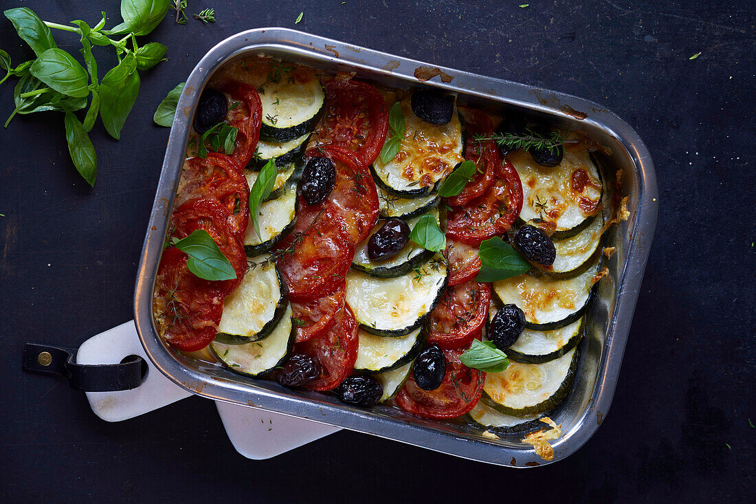 Scooping Vegetable Casserole with Tomatoes, Zucchini and Summer Squash