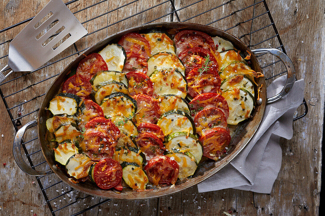 Scooping Vegetable Casserole with Tomatoes, Zucchini and Summer Squash