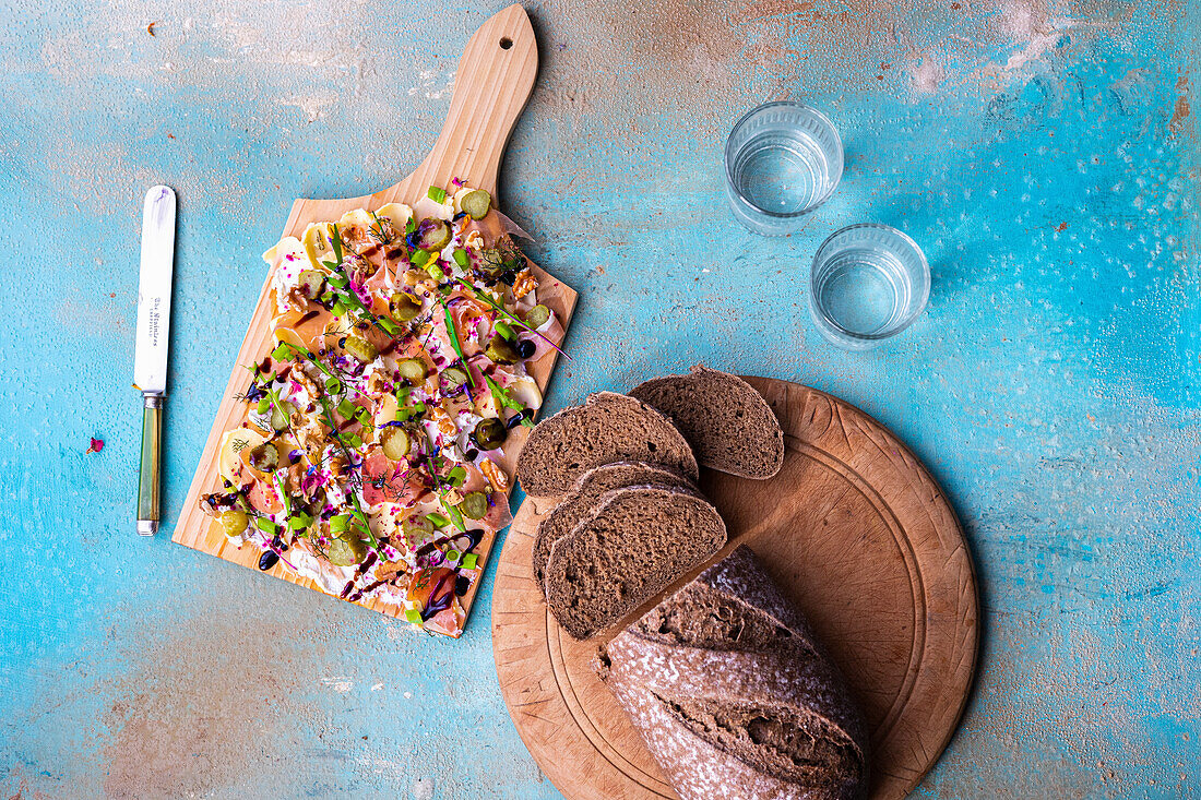 Butter Board with fennel, cucumber, Parma ham, walnuts, cream cheese and rye bread