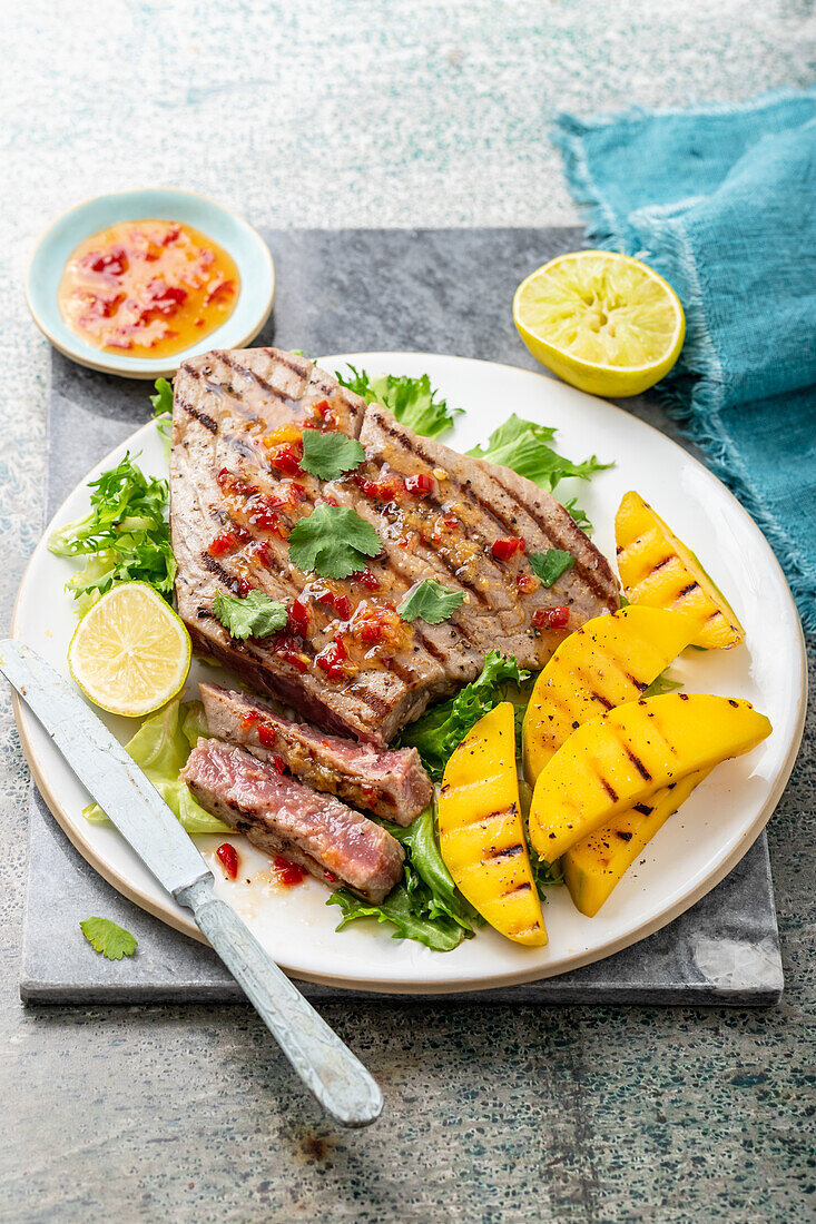 Grilled tuna steak with mango, sweet chili sauce and cilantro