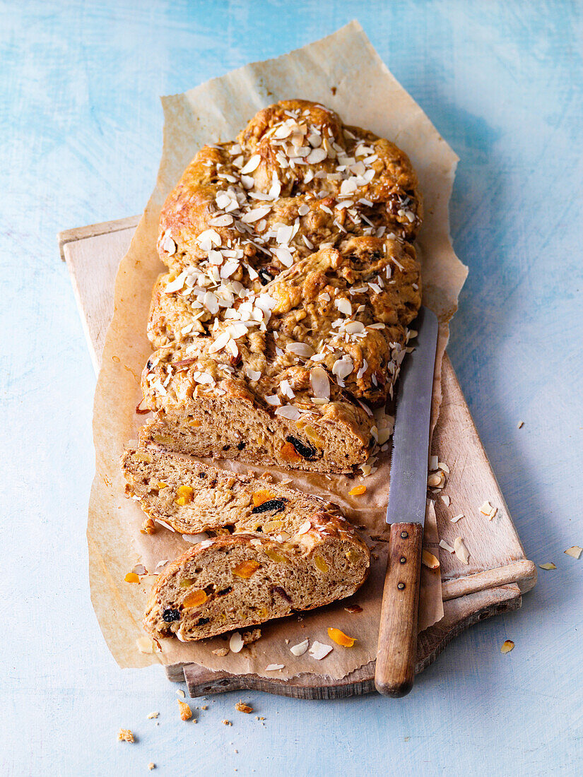 Sweet yeast braided bread with dried fruits