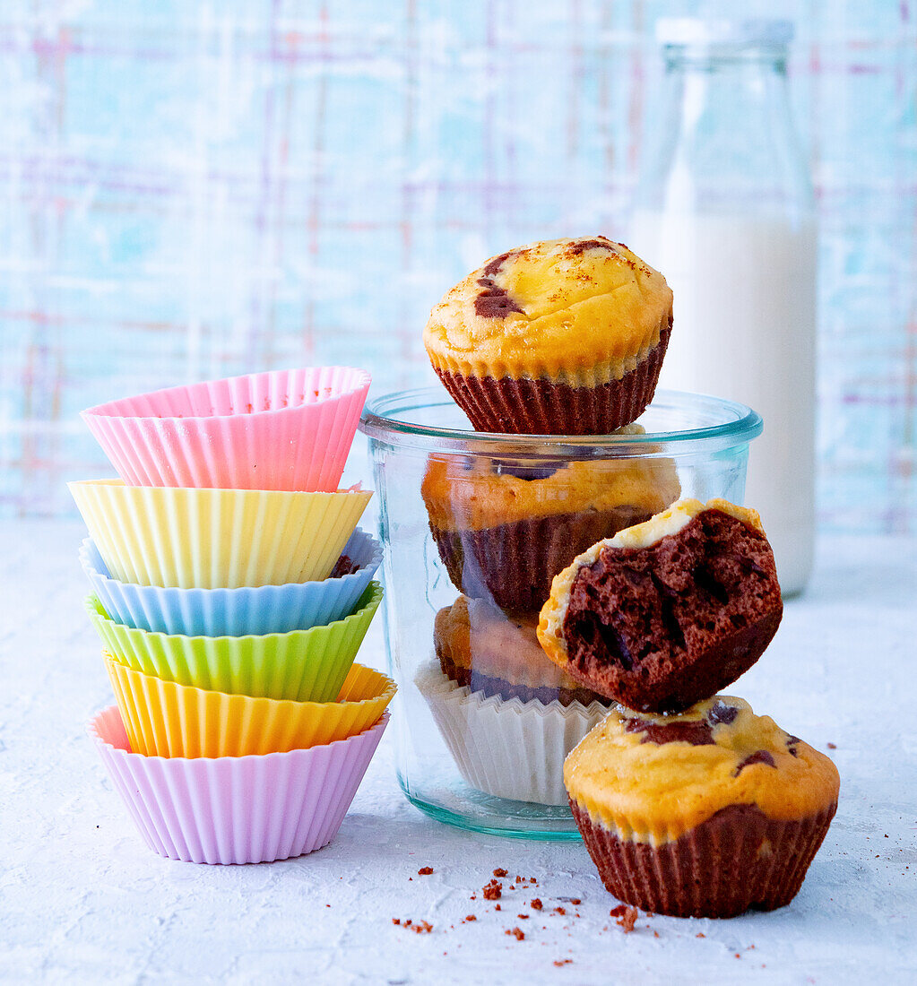 Cheesecake Chocolate Muffins next to a stack of silicone muffin liners