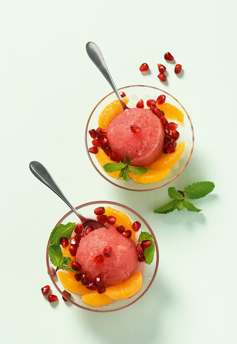 Pink grapefruit sorbet with oranges and pomegranate seeds