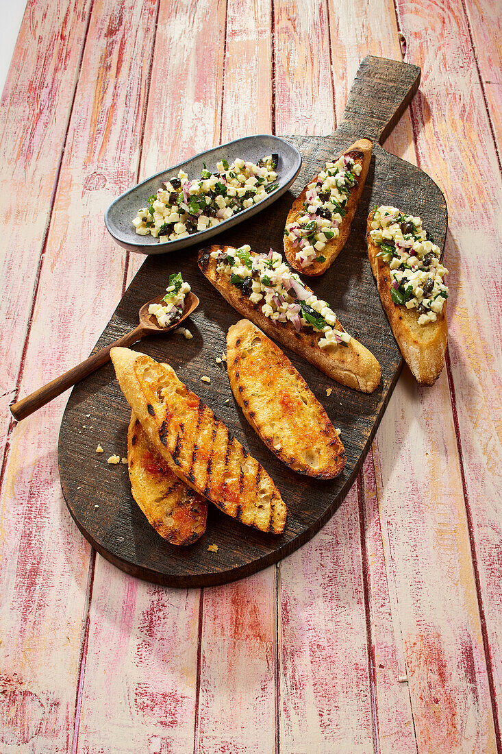 Grilled tomato bread and crostini with feta cheese tartare