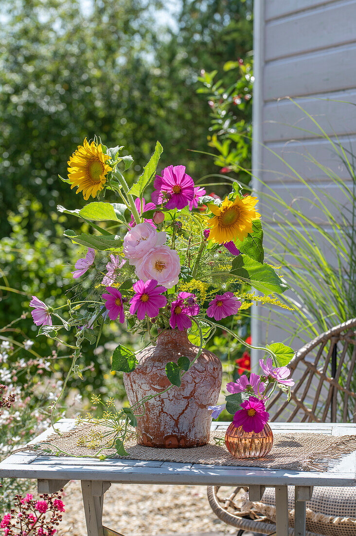 Bouquet of sunflowers, jewel basket and roses