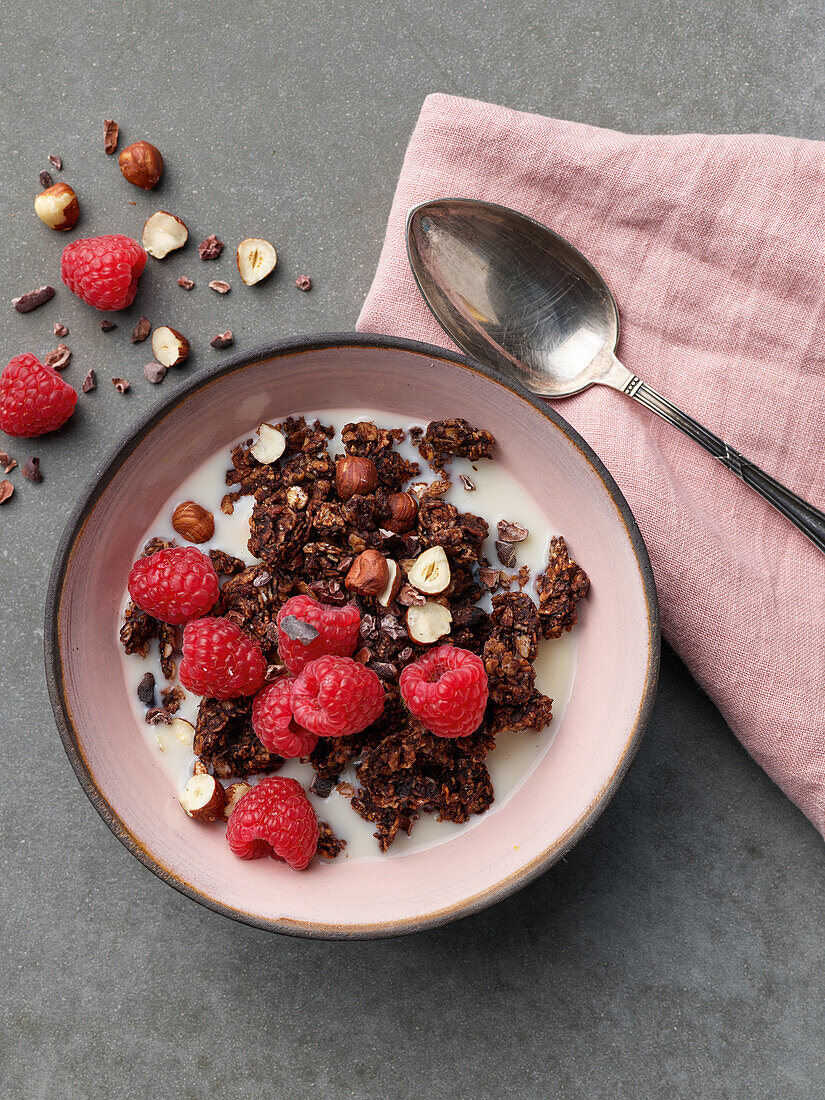 Quick pan granola with almond milk, nuts and raspberries