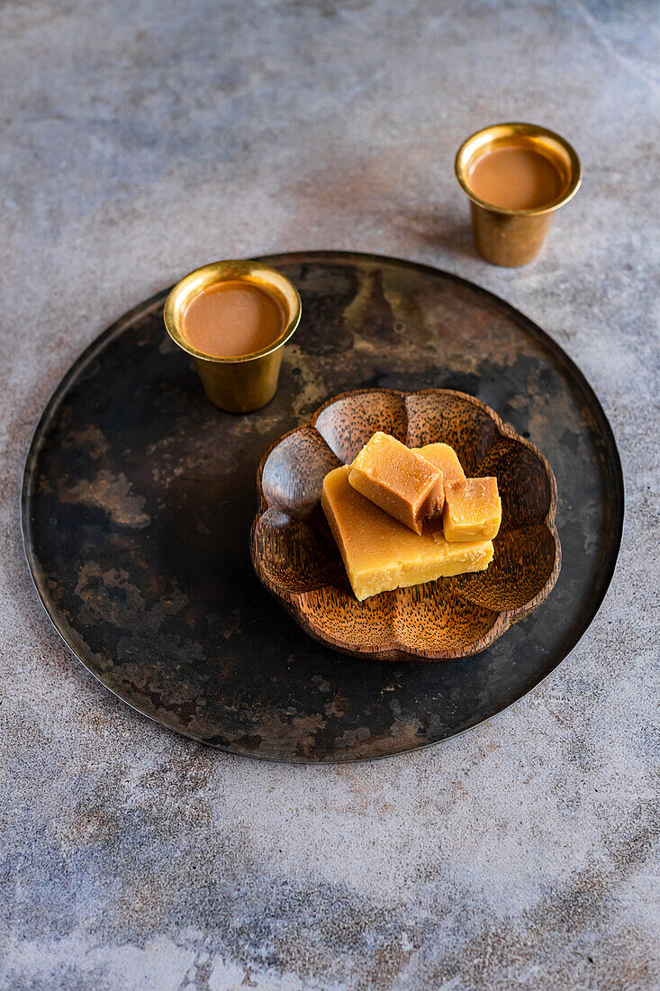 Mysurpa (Traditional Indian sweet made from ghee) with Masala Chai