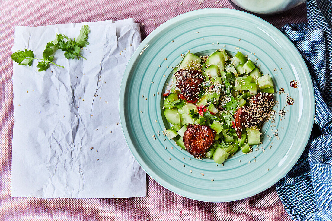 Cucumber salad with chicken and sesame seeds