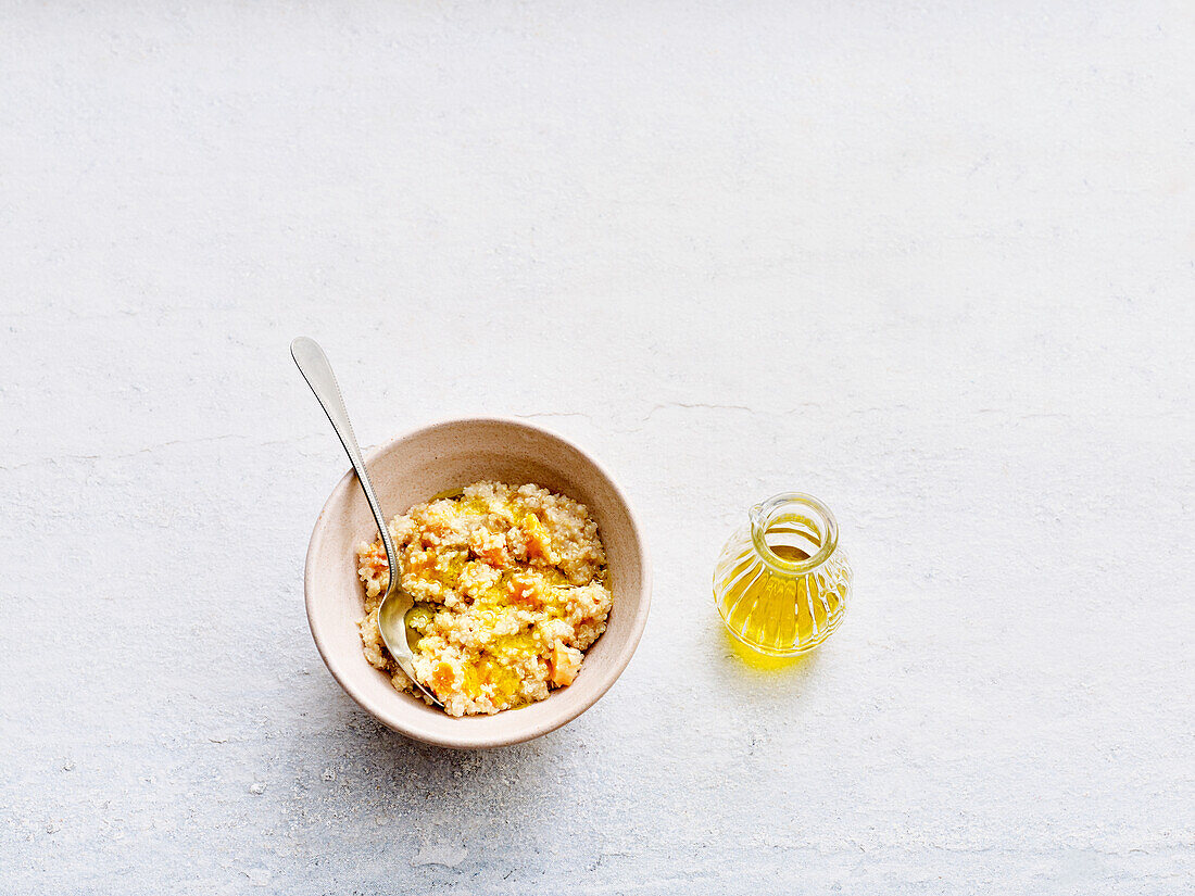 Vegan quinoa porridge with apricots and vegetable cream