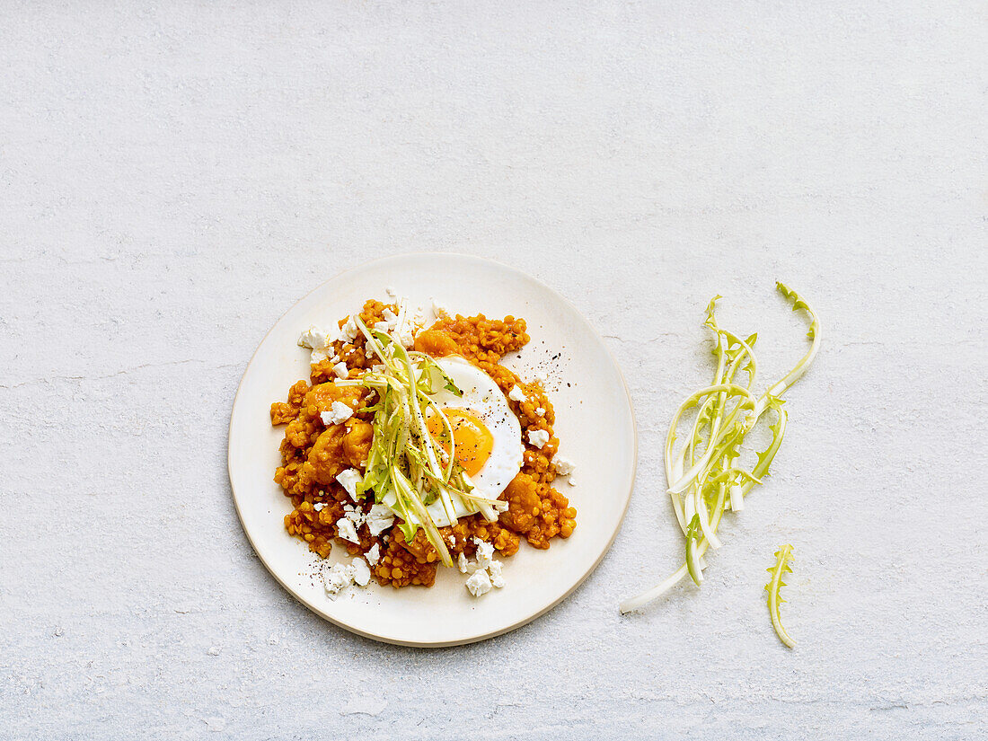 Apricot lentil dal with feta and fried egg