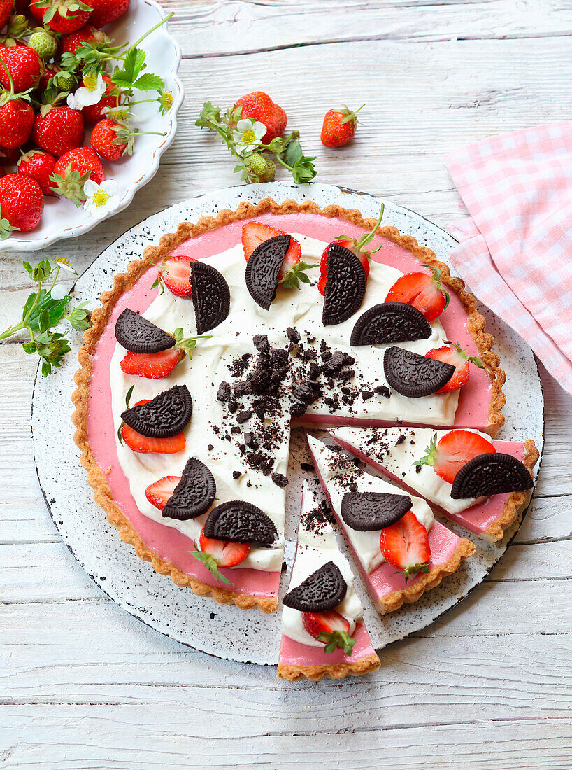 Strawberry cookie pie with fluffy cream and Oreo cookies
