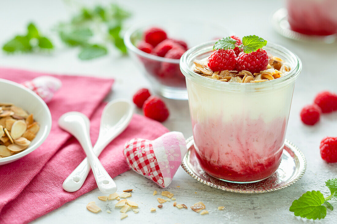 Raspberry yogurt with fresh raspberries and almonds