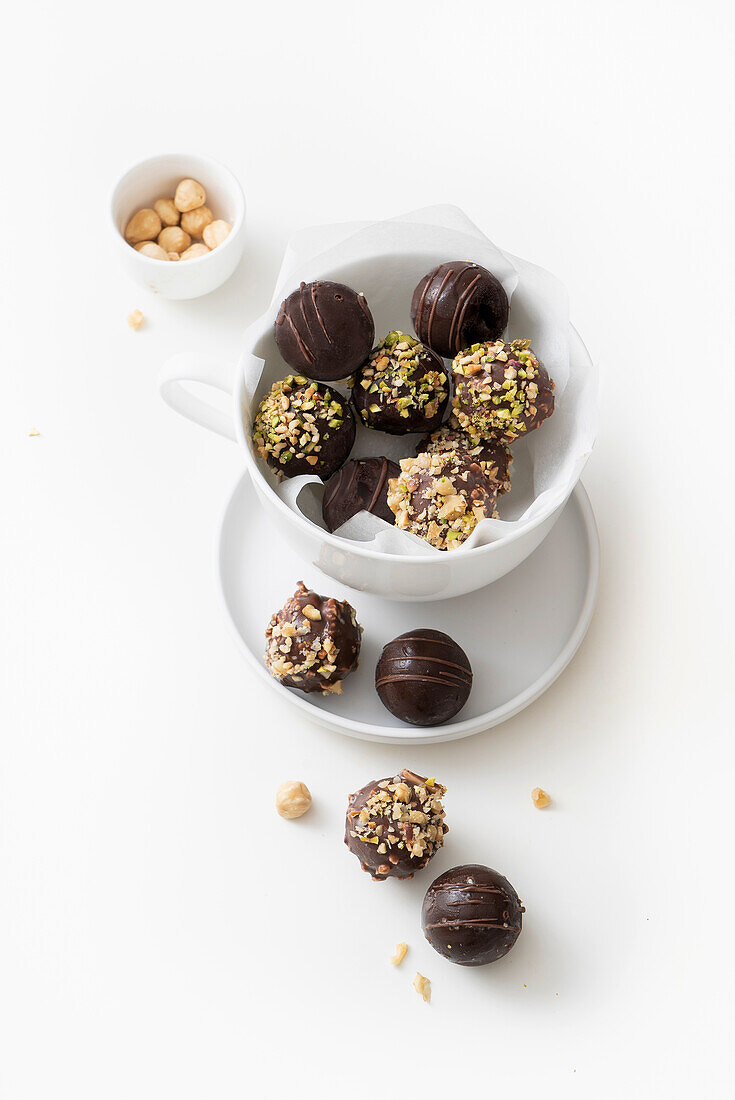 Rum balls with chocolate icing and pistachios