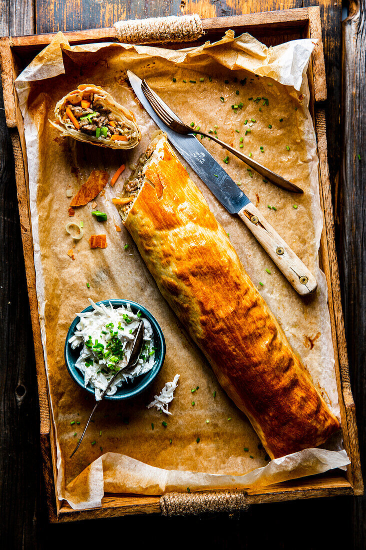 Meat strudel with horseradish cream