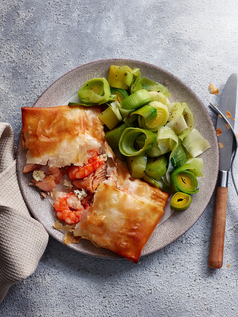 Creamy trout and shrimp parcels with leeks
