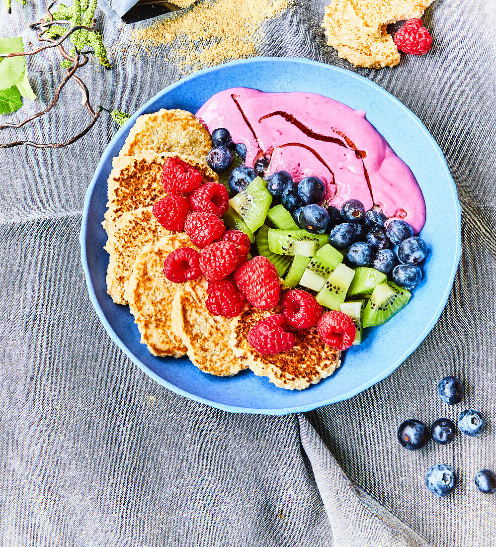 Pancakes with fruit and berry cream