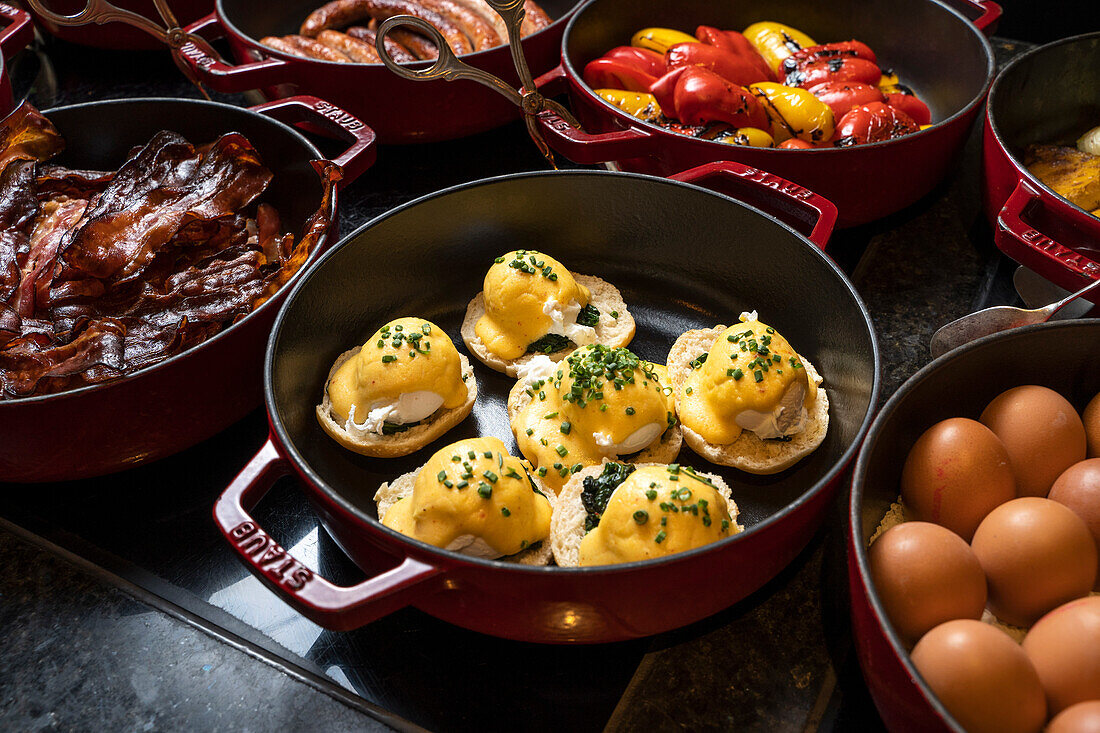 Breakfast buffet with eggs, bacon and grilled vegetables