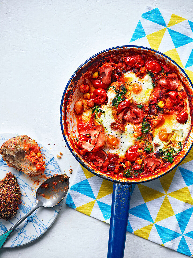 Bean and tomato pan with baked eggs