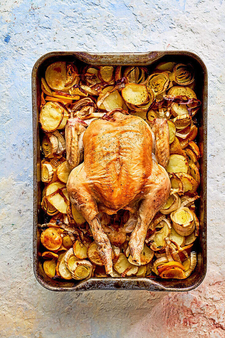 Whole roasted chicken with braised potatoes